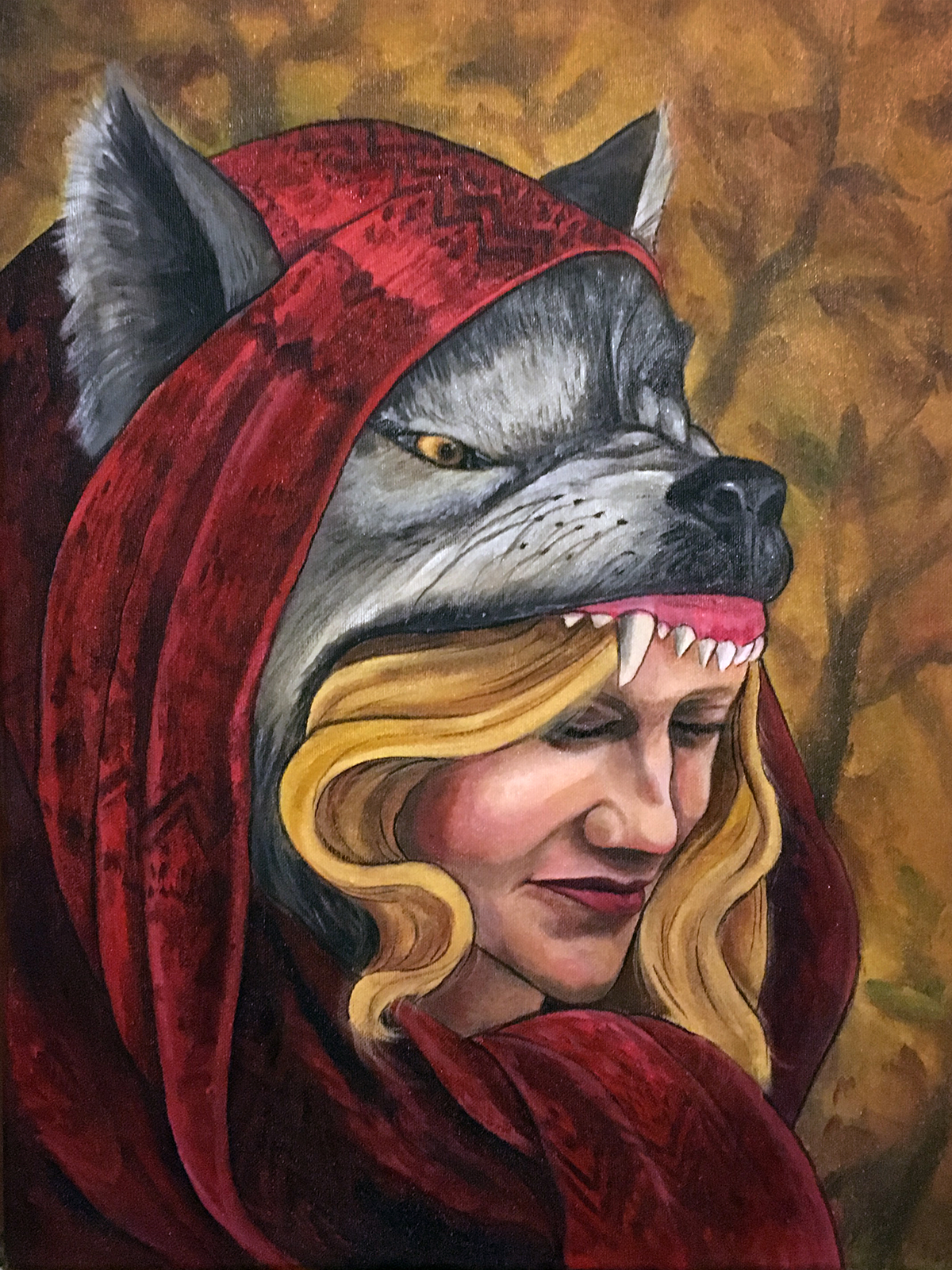 portrait of a young woman wearing a wolfs head and red scarf against an autumn forest backdrop